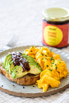 Boomz Sambal on avocado toast – spicy Asian chili sauce. Flavor egg dishes like Sambal Omelette, Sambal Scramble Eggs